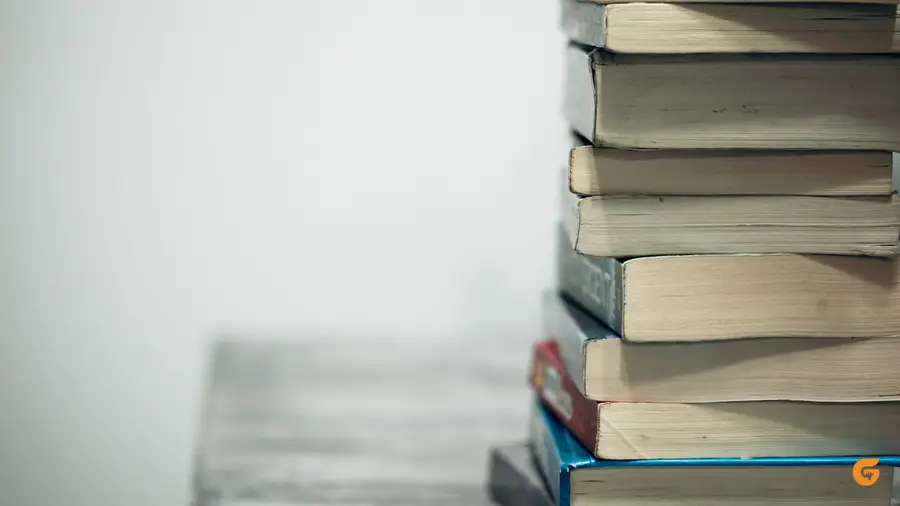 A laptop resting on an open book