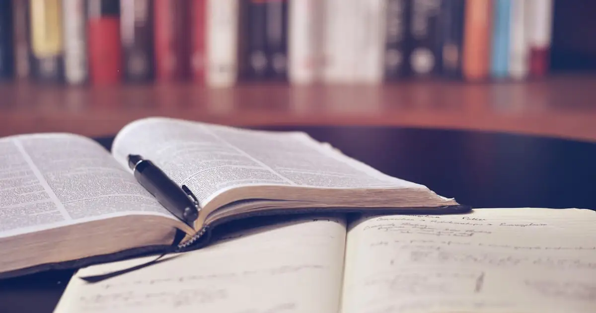 A notebook and coffee on a desk